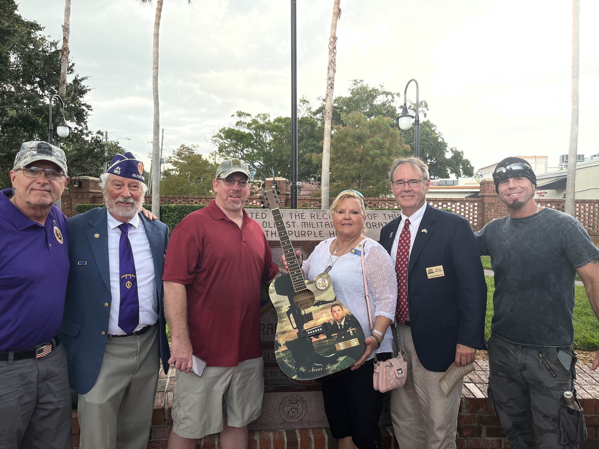 Dave Eggers with veterans at Purple Heart memorial
